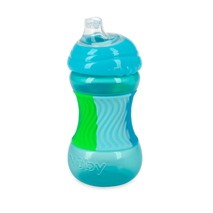 The Nuby Clik-It Sili Bands Soft Spout Sippy Cup is a blue and green cup for young children, featuring a soft, spill-proof spout, textured grip sides, and the Nuby brand embossed near the base.