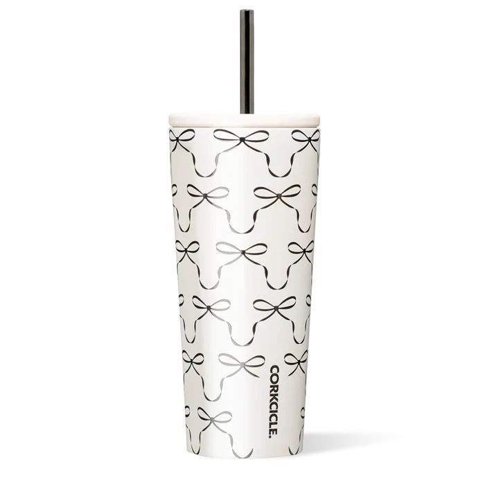 Tumbler with black bow pattern on a white background