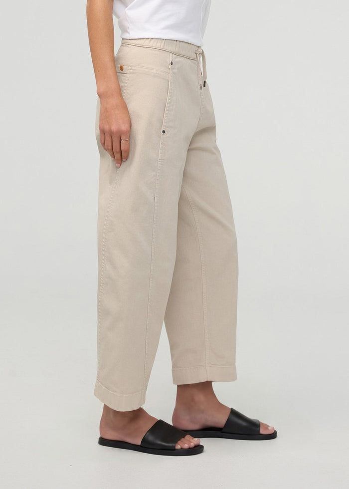 Sandstone pull-on barrel pants with relaxed fit, cropped length, and visible stitching details.