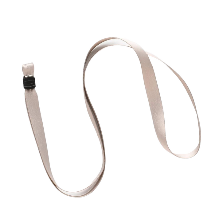 A light brown, smooth satin ribbon is shown against a plain white background. The ribbon is loosely coiled, resembling the Lanyard - Plain Nude by Coconut Lane, with one end featuring a small black clip attachment.